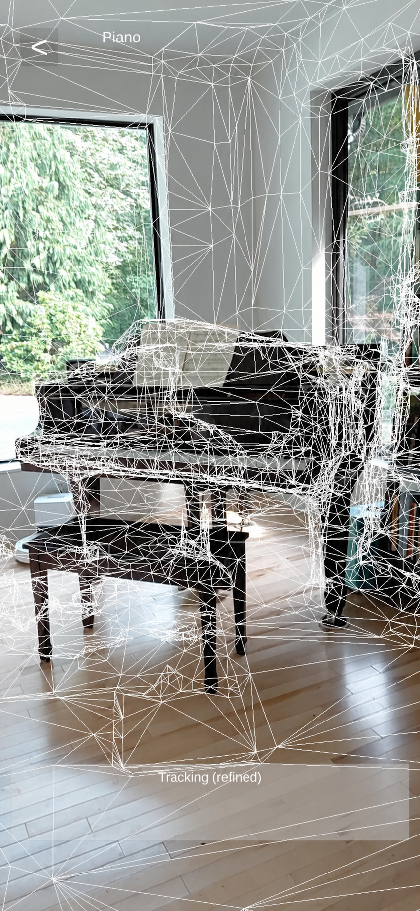 AR camera view showing the downloaded Site mesh during refined tracking